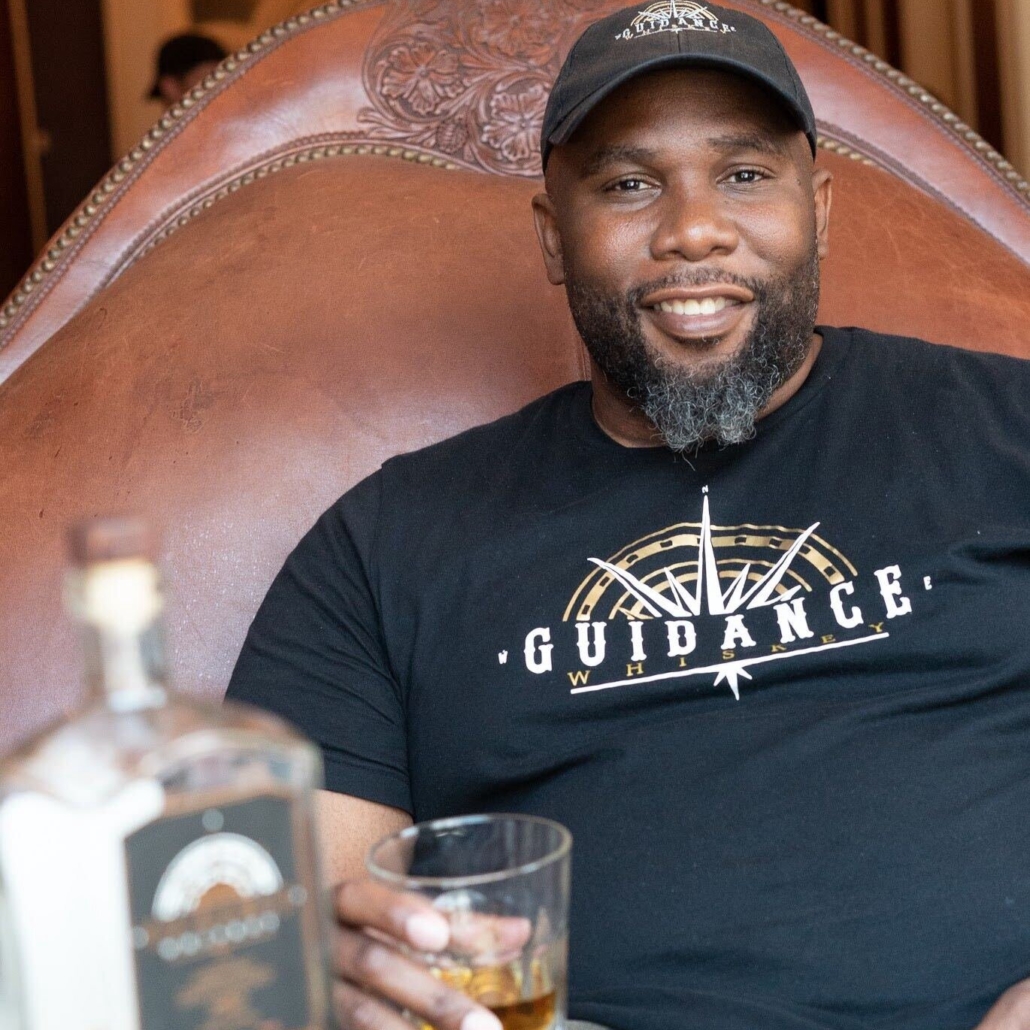 Owner of Guidance Whiskey, Jason Ridgel, drinking whiskey in Nashville, TN.